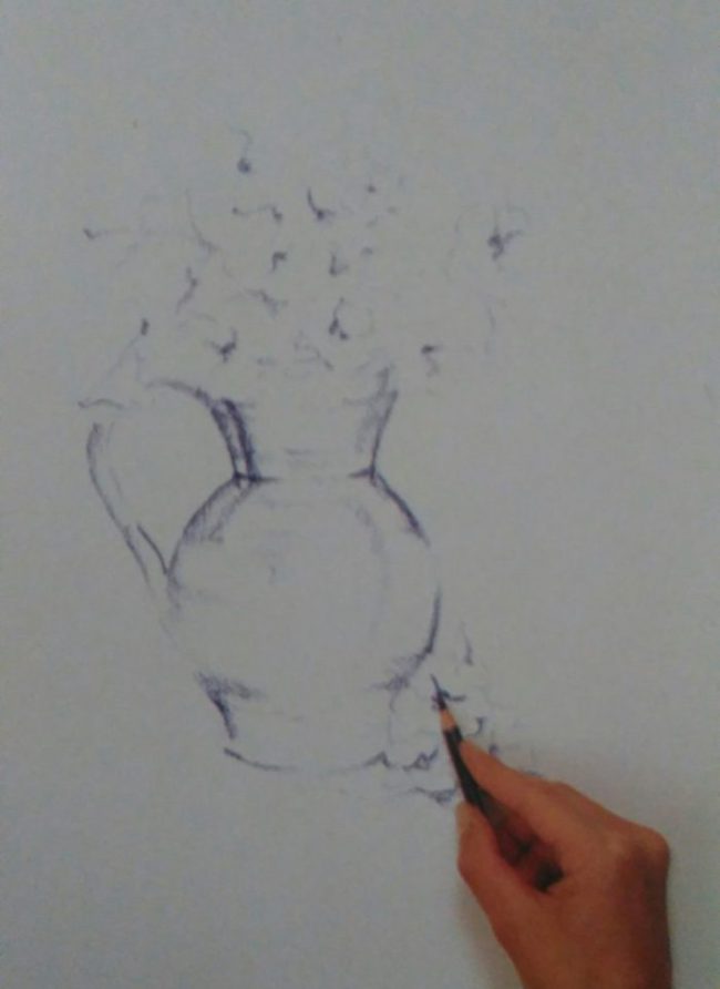 hand sketching a jug with flowers using colored pencils