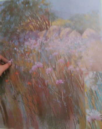 hand finishing the drawing of wild flowers