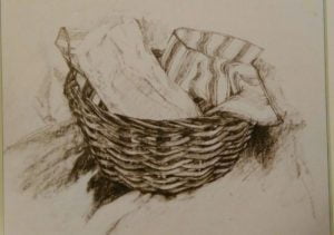 Drawing made with graphite sticks depicting a basket with two pieces of cloth