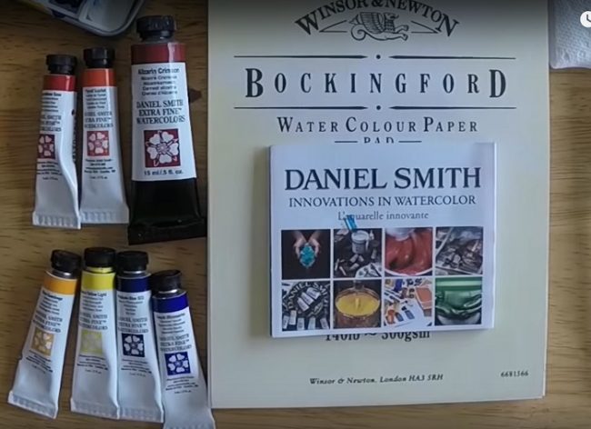 several tubes of Daniel Smith watercolors nets to watercolor paper