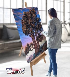 Woman painting on a large canvas mounted on US Art Supply easel